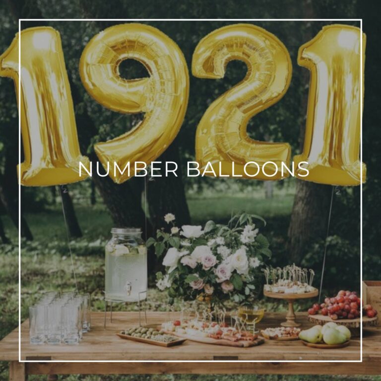 giant number balloons spelling 1921 above a dessert table for an 100th birthday party