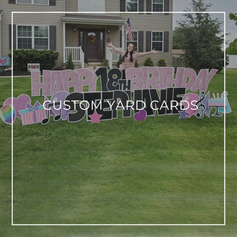 custom name and age happy birthday yard card set up on front lawn outside house