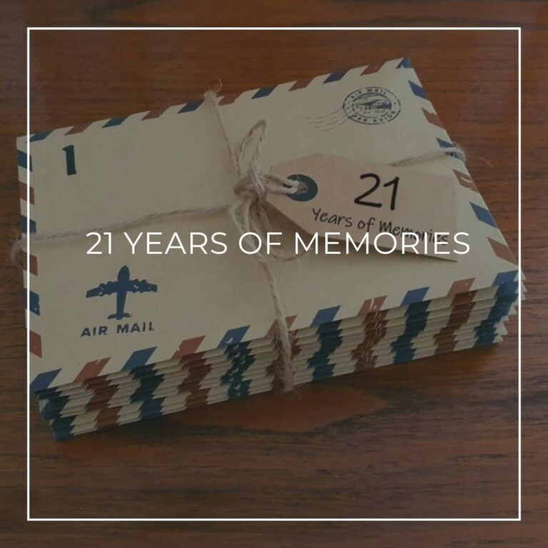 a stack of numbered '21 years of memory' letters in air mail envelopes