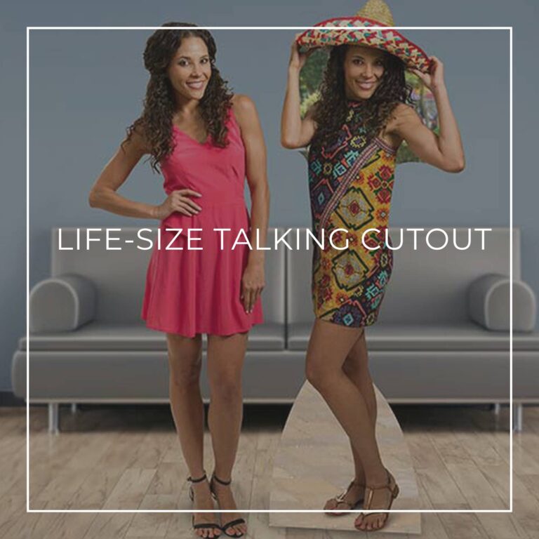 30 year old woman standing next to a life-size cutout standee of herself