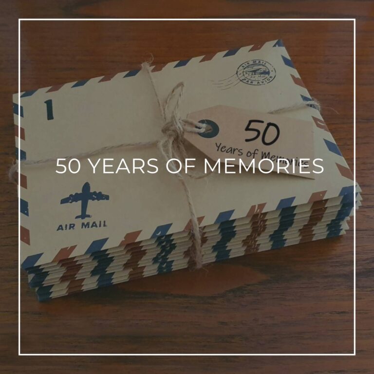 a stack of numbered '50 years of memory' letters in air mail envelopes
