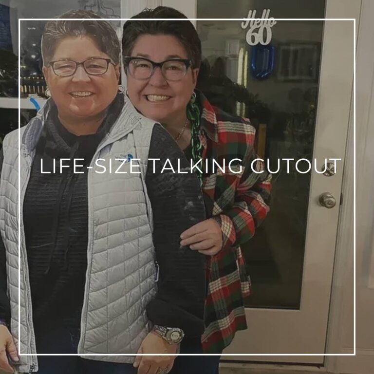 60 year old man seated next to a life-size cutout standee of himself