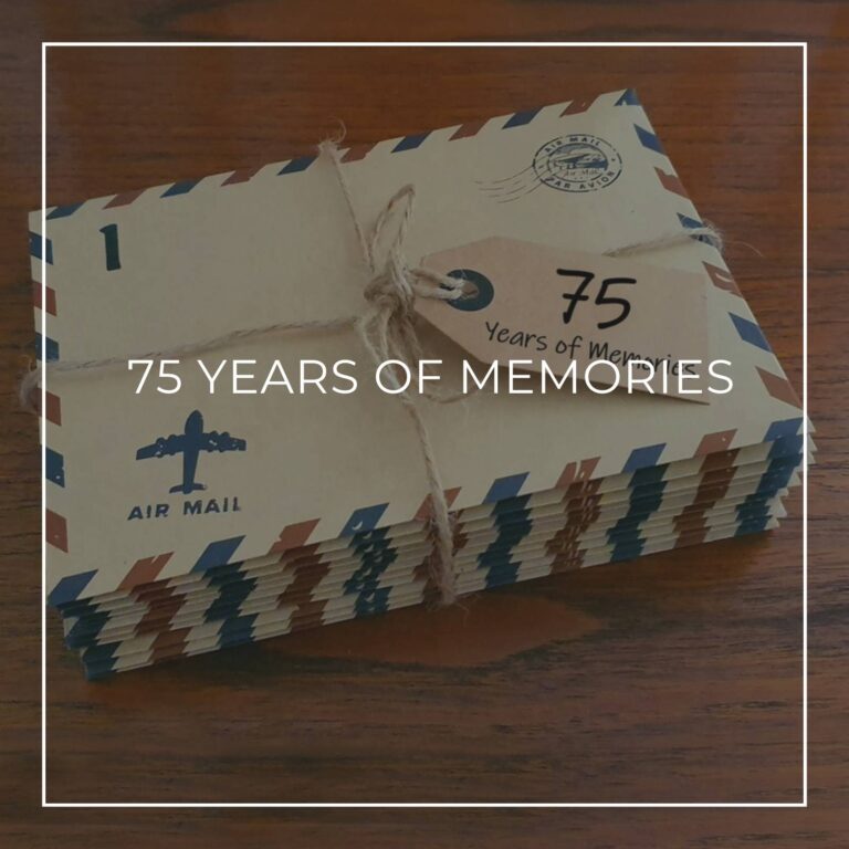 a stack of numbered '75 years of memory' letters in air mail envelopes