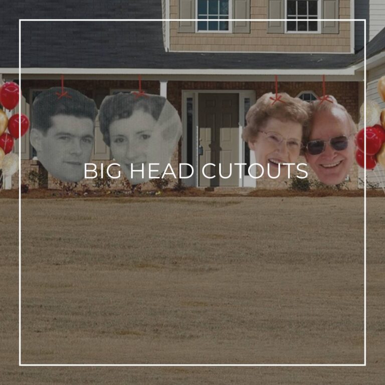 giant face cutouts showing the happy couple at different stages of their life decorating the entrance to a house