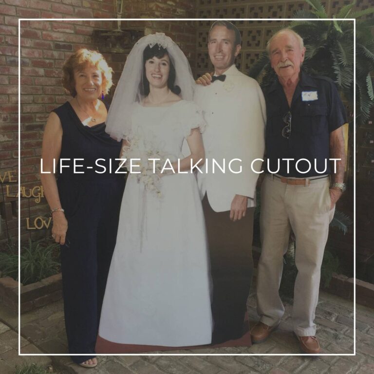 senior couple standing next to a life-size cutout standee of their younger selves on their wedding day