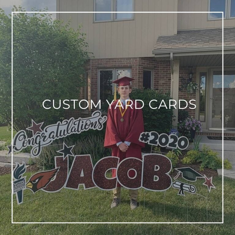 custom name and year congratulations graduation yard card set up on front lawn outside house