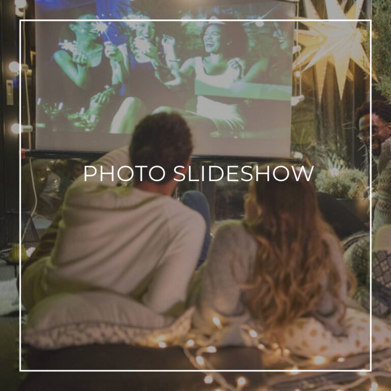 group of friends watching a backyard slideshow