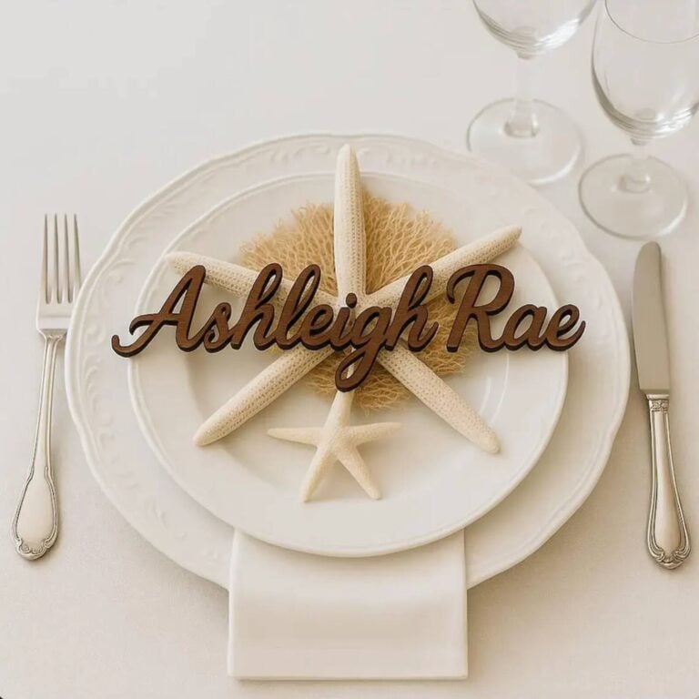 Dark wood 3D script name Ashleigh Rae on a white plate with starfish and dried coral