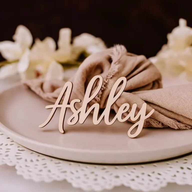 Light wood 3D script name Ashley on a blush napkin and plate with a white lace doily