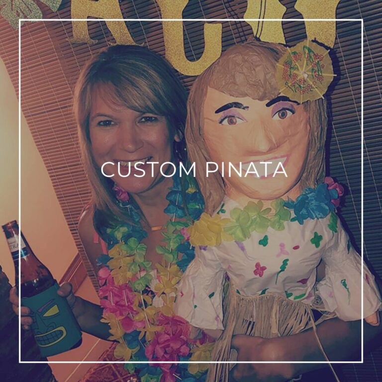 man standing next to a custom pinata of himself