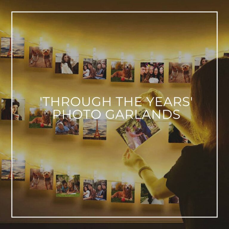 woman hanging a photo on interactive photo garland party decorations showing the 60th birthday boy 'Through the Years'