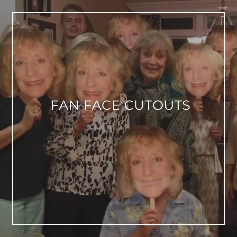 group of people holding custom fan faces of the 70th birthday girl in front of their own faces