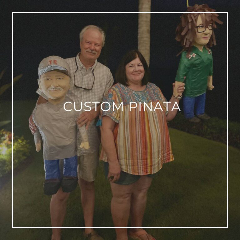 man standing next to a custom pinata of himself