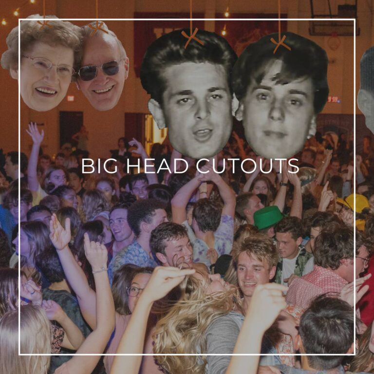 giant custom face cutouts showing the happy couple at different ages used as hanging decorations above a crowd of dancing party guests