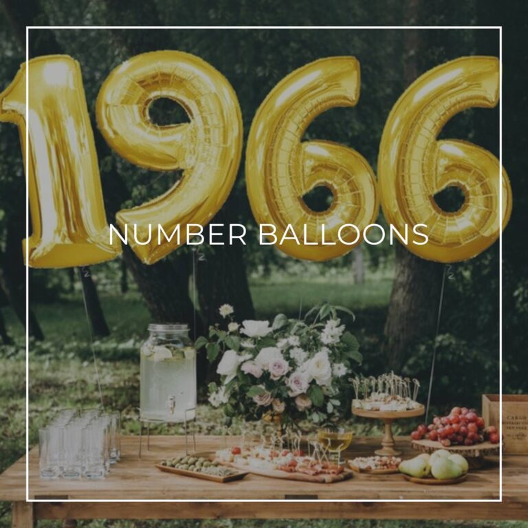 giant number balloons spelling 50 above a dessert table for an anniversary party