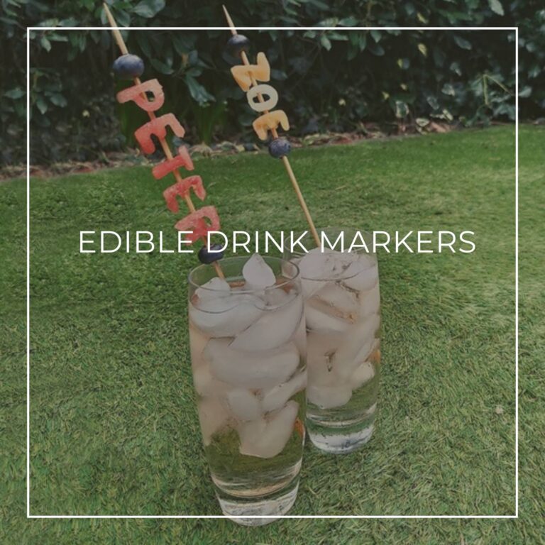 party drinks with edible drinks markers made of fruit spelling out the names PETER and ZOE on bamboo skewers