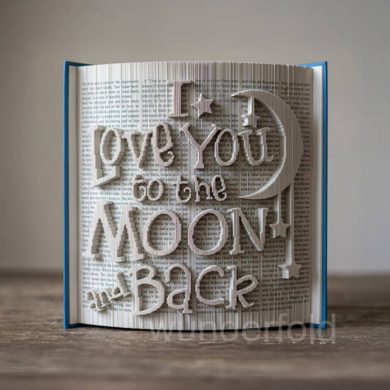 Book folding art forming the words “I love you to the moon and back” with a moon and star cutout