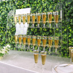 champagne glasses filled with champagne displayed on an acrylic tabletop display stand