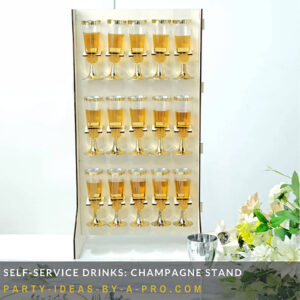 rows of champagne glasses filled with champagne on a stand