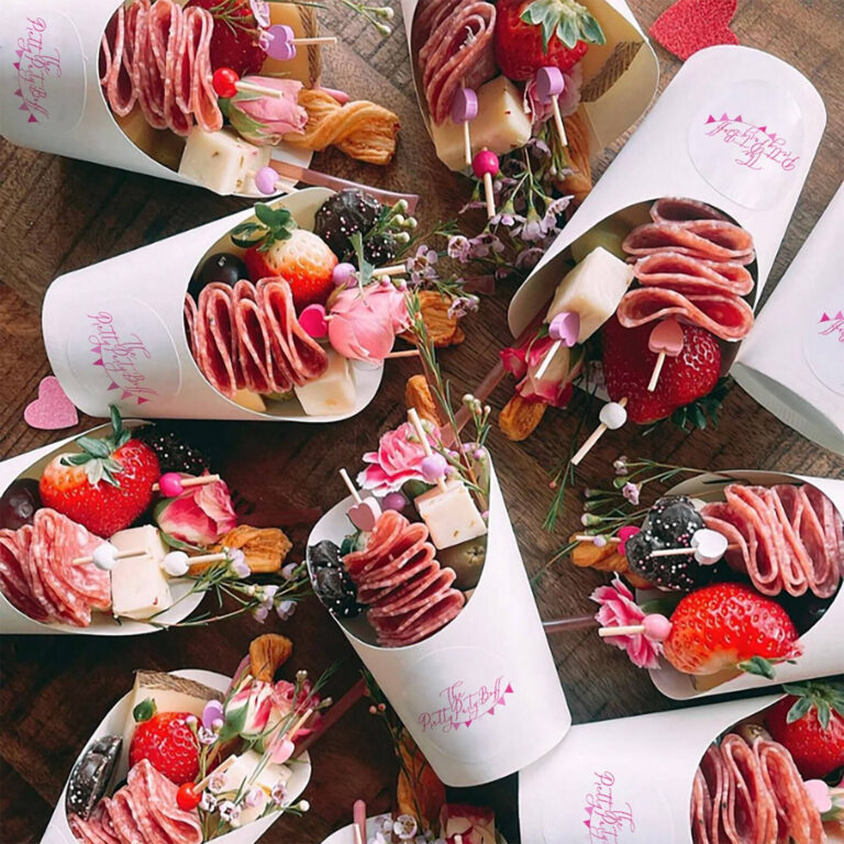 Individual charcuterie cups arranged in rows