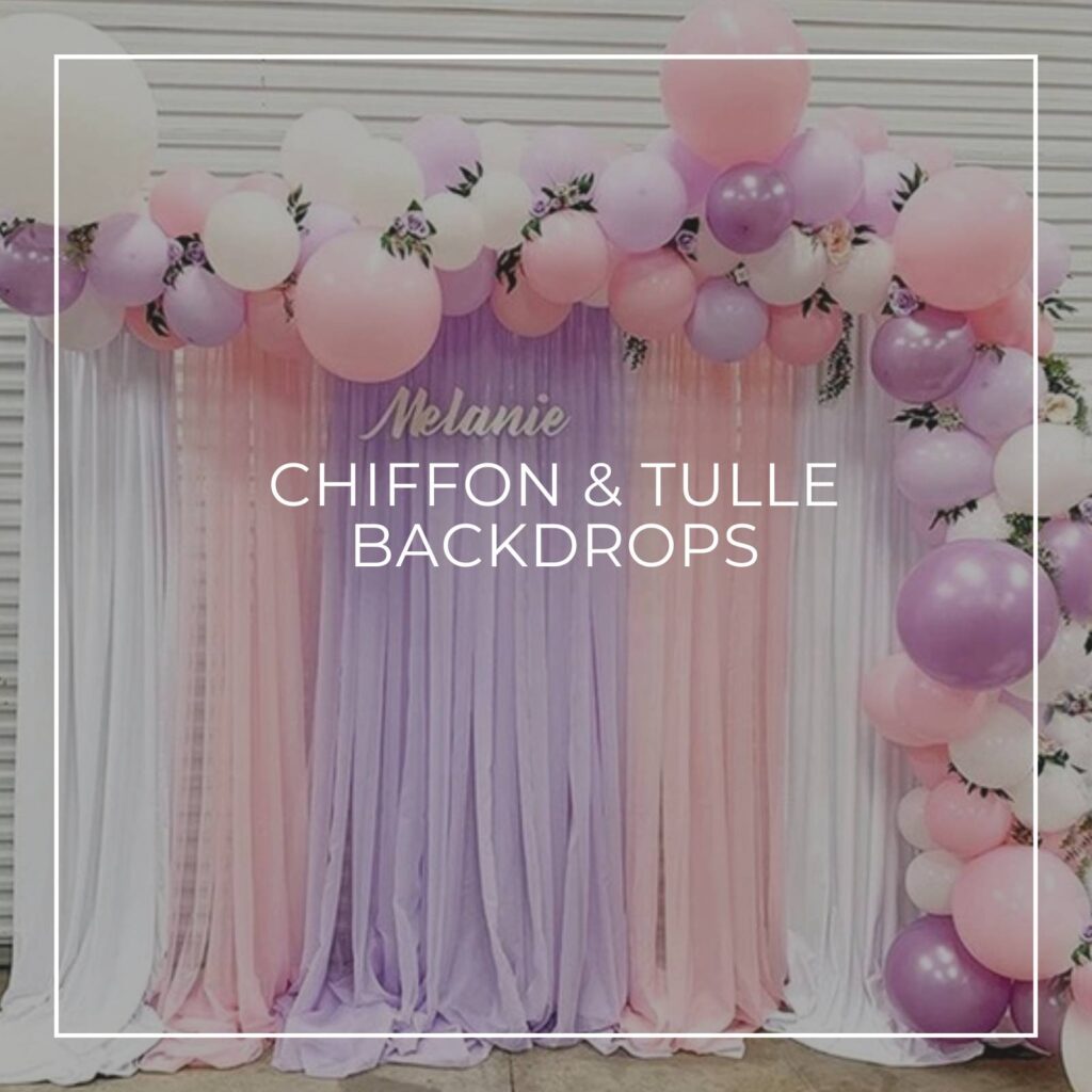 pink, purple, and white chiffon / tulle fabric party backdrop with balloons and name sign spelling Melanie