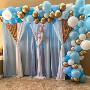 pastel blue and white chiffon tulle fabric party backdrop for a baby shower party
