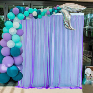 purple and turquoise chiffon tulle fabric party backdrop for a mermaid themed party