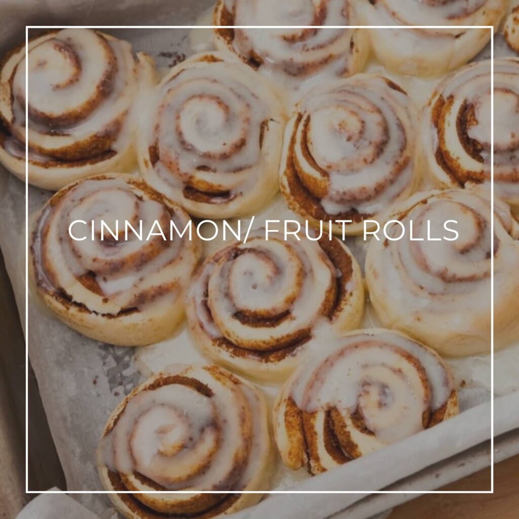 iced cinnamon rolls in a baking pan
