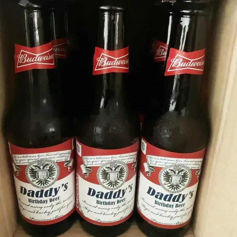 Three dark bottles with red-and-white Budweiser-style custom labels reading "Daddy's Birthday Beer"