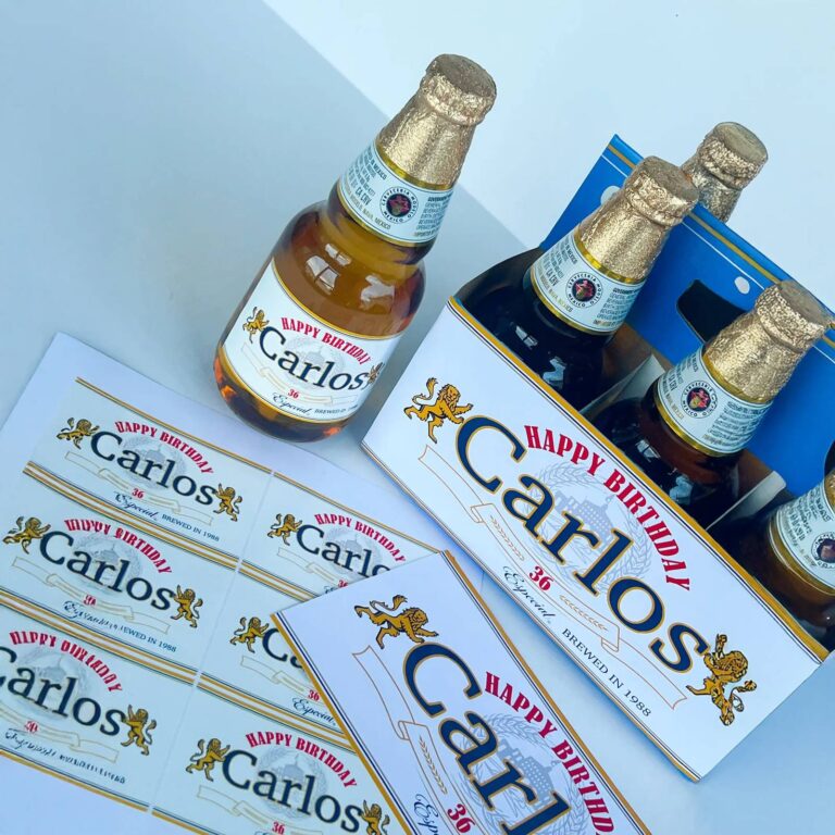 Corona-style bottle and six-pack carrier with custom "Happy Birthday Carlos, 36, Especial, Brewed in 1988" labels, plus a sheet of matching printed labels