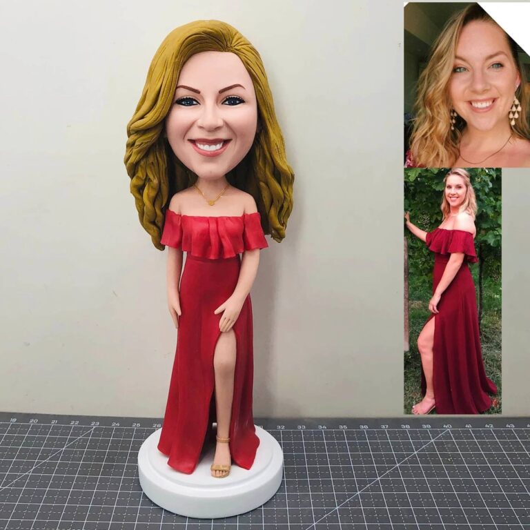Custom bobblehead in a red off-shoulder gown with leg slit, matched to reference photos