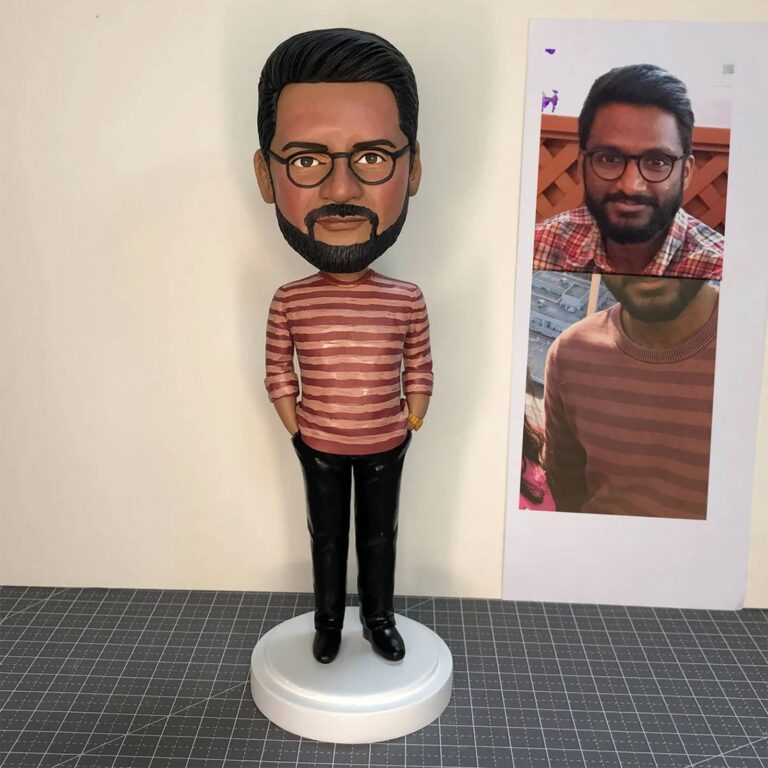 Custom bobblehead of a bearded man with glasses wearing a striped shirt and black pants