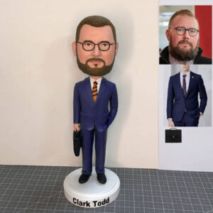 custom bobblehead of man with beard and glasses in blue suit
