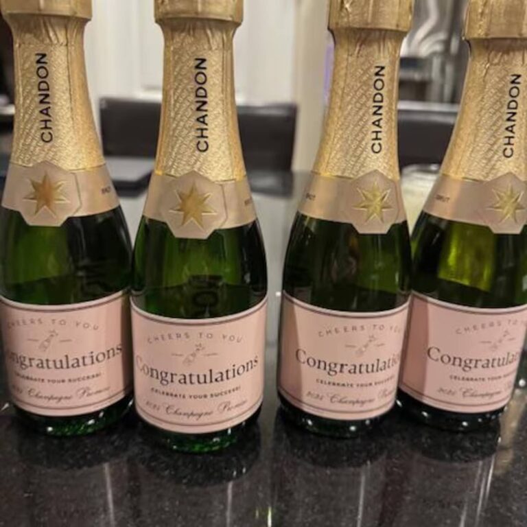 Four Chandon bottles in a row with matching pink "Cheers to You, Congratulations" labels