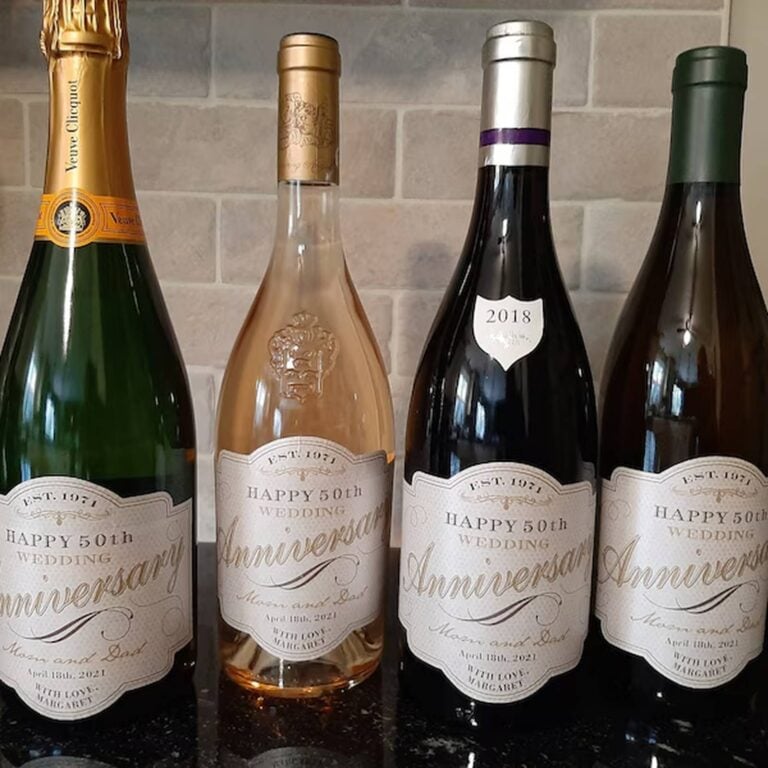 Four wine and champagne bottles in different colors, each with a matching "Happy 50th Wedding Anniversary, Mom and Dad" label