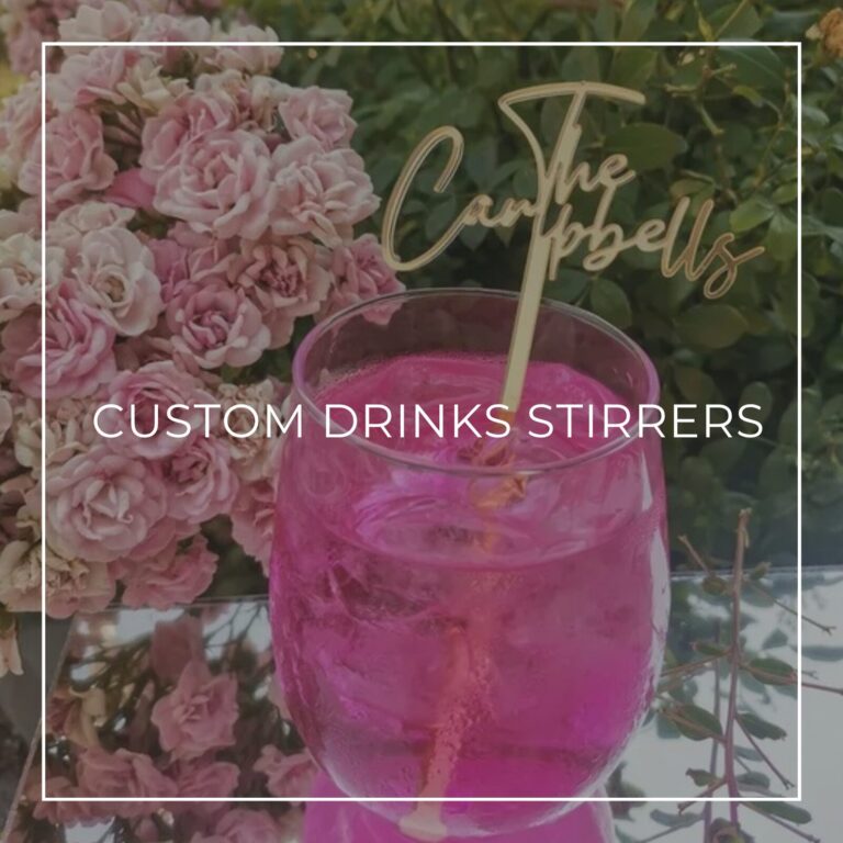 Custom Drinks Stirrers title image with a gold acrylic stirrer reading “The Campbells” in a pink drink
