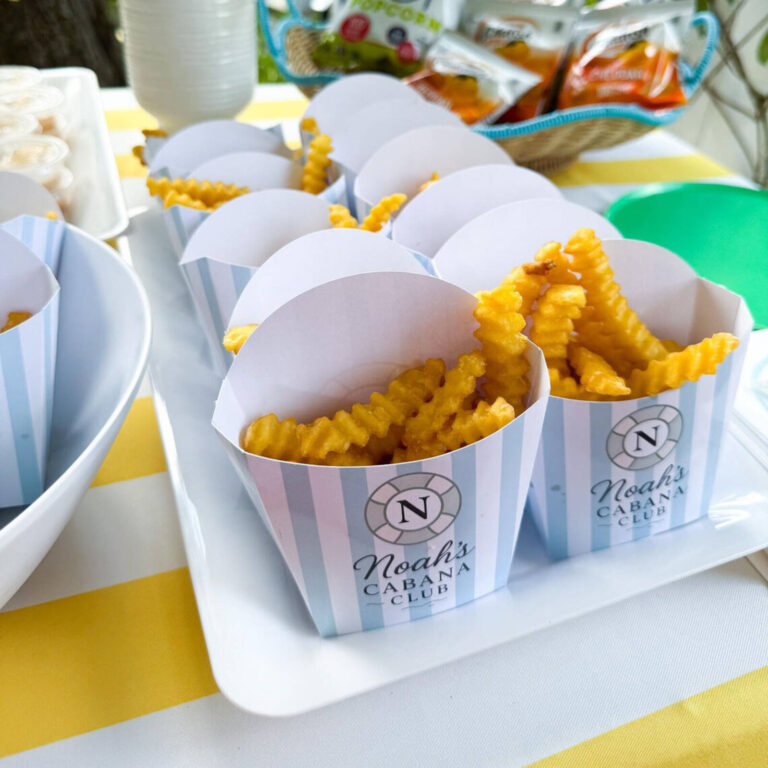 “Noah’s Cabana Club” fry boxes filled with crinkle-cut fries