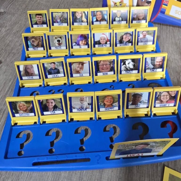 Custom Guess Who board with family and pet tiles including Grammy, Pawpaw, and dogs Maisy and Mackie