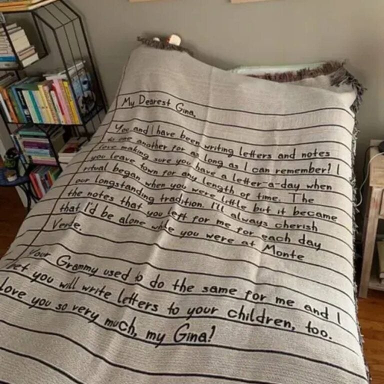 Blanket with a letter ‘My Dearest Gina’ about a lifelong letter-writing tradition, draped over a chair