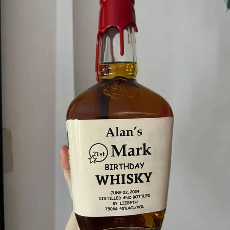Whiskey bottle with a dripping red wax seal and an "Alan’s Mark, 21st Birthday Whisky" label