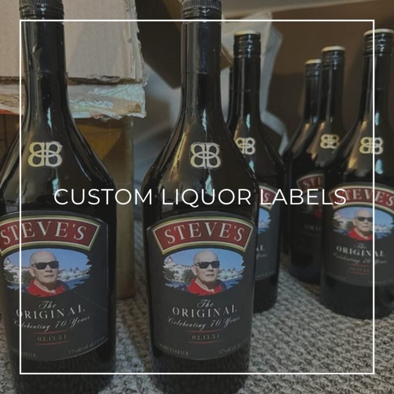 Row of dark liquor bottles with custom "Steve’s, The Original, Celebrating 70 Years" labels featuring a smiling bald man in sunglasses, labeled "Custom Liquor Labels"