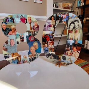 freestanding photo collage of the number 80