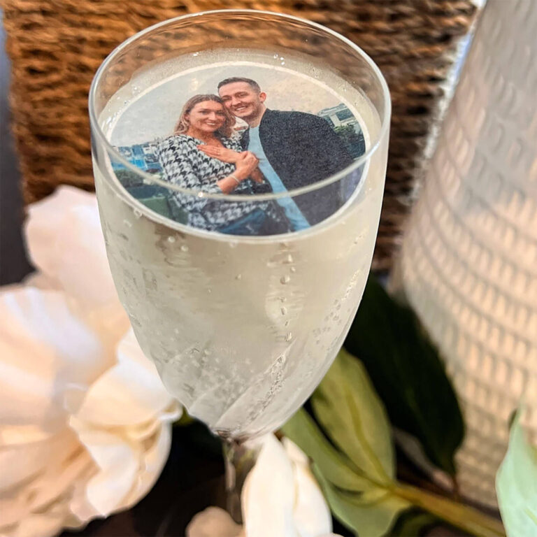 custom photo edible wafer party drinks topper with a photo of a couple floating on champagne in a flute