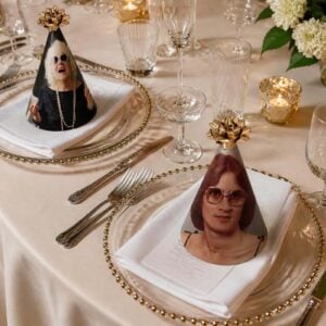 custom photo party hats on each place setting at a dinner table