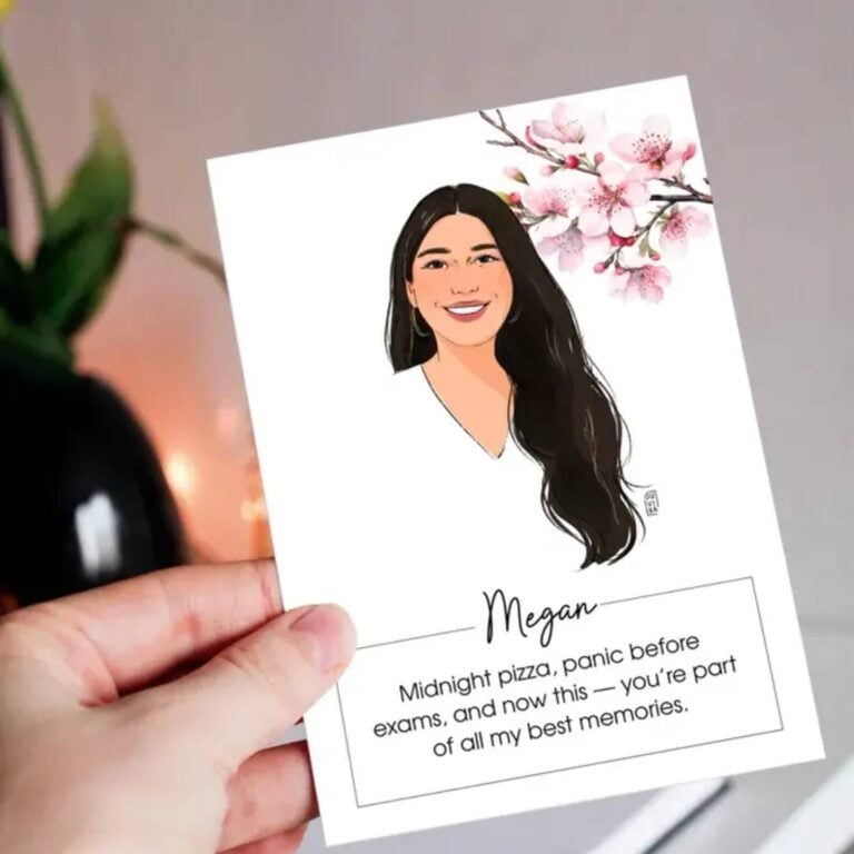 Hand holding a portrait place card of Megan with cherry blossoms and a personal message