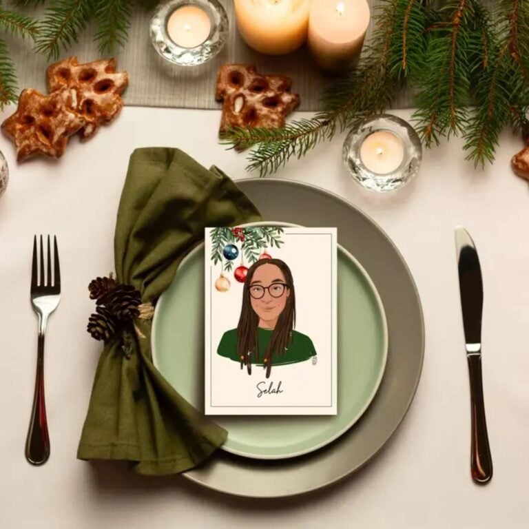 Christmas portrait place card for Selah with baubles and greenery on a green plate and napkin