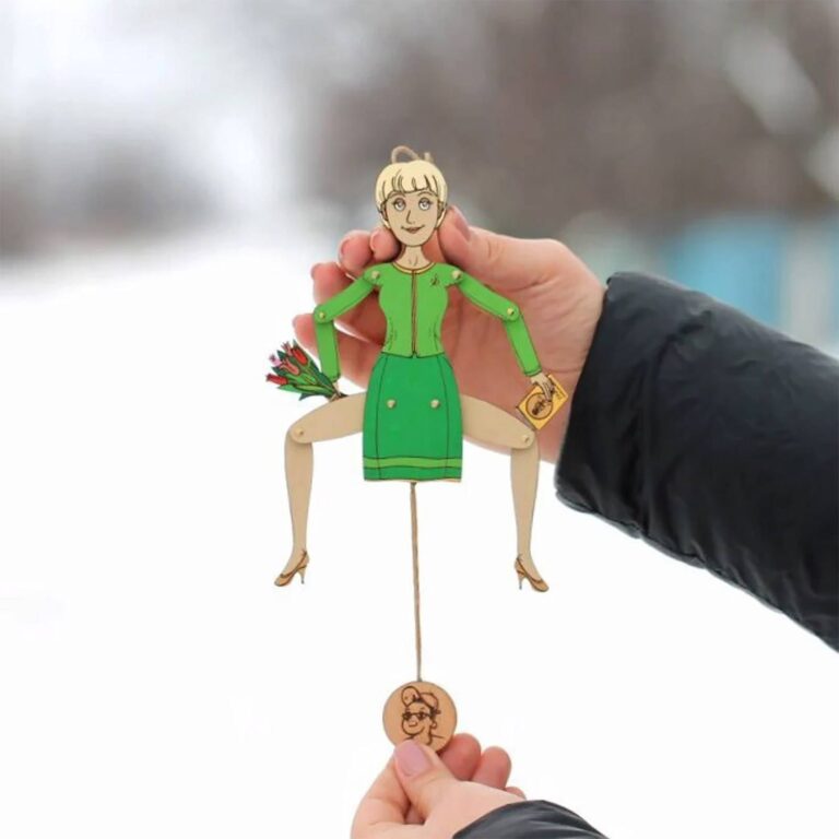 Custom wooden portrait ornament of a woman in a green dress suit holding tulips, with pull-string mechanism and engraved face disc