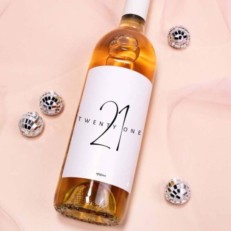 Wine bottle with a “Twenty-One” label featuring a bold 21 numeral and disco balls on pink
