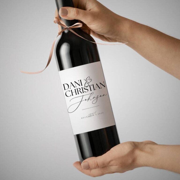 Ribbon-tied wine bottle labeled “Dani & Christian Johnson” with engagement date December 1, 2024