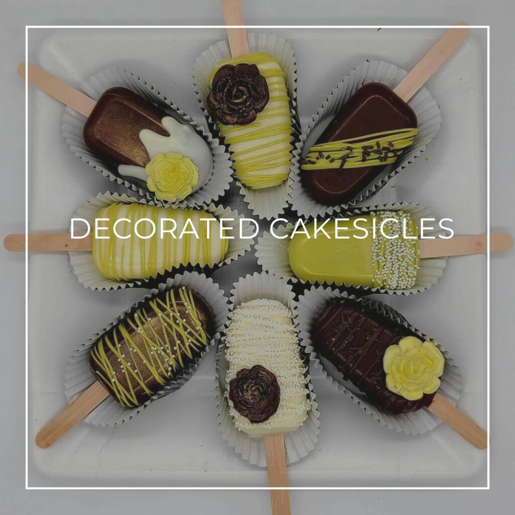 elegantly decorated cakesicles arranged on a plate